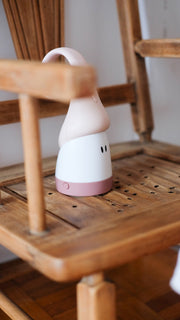 Beaba Pixie Torch hanging from a wooden chair