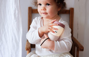 Child holding a Beaba Pixie Torch